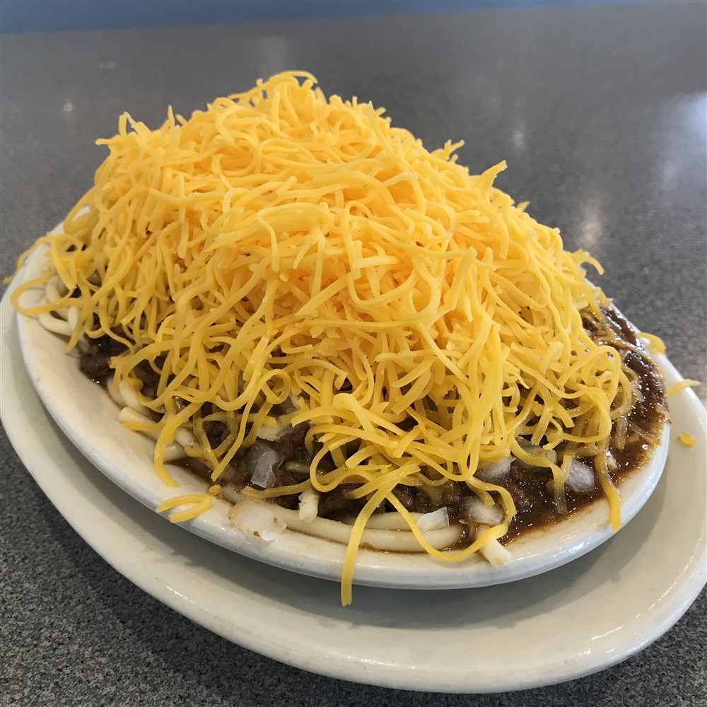 Four-way Cincinnati chili topped with shredded cheese at Camp Washington Chili